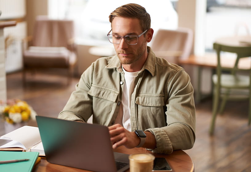 Man using a laptop in a casual setting